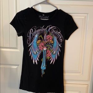 Black Bejeweled shirt with cross and rose design.